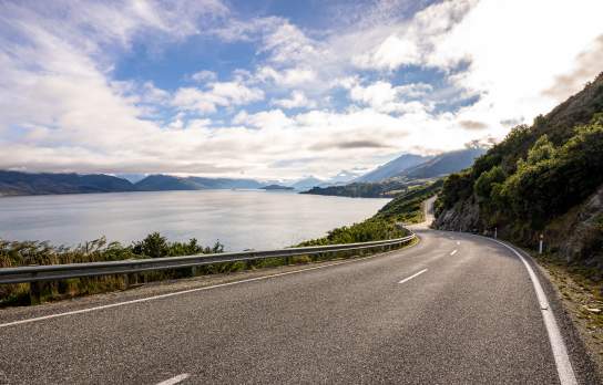 Iconic Queenstown Glenorchy Road with lake and mountain views