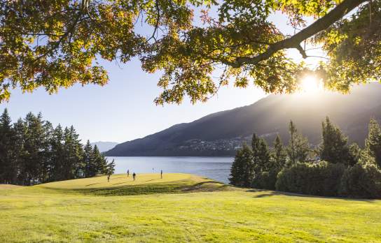 Golfers at Queenstown Golf course in spring