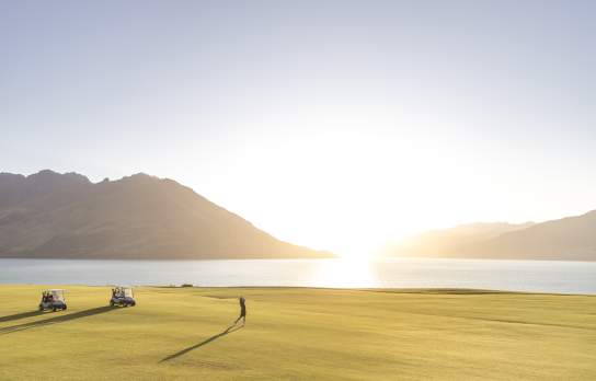 Golfer takes a swing at Jacks Point in summer