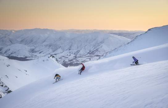 Group Skiing at The Remarkables Ski Field at sunrise