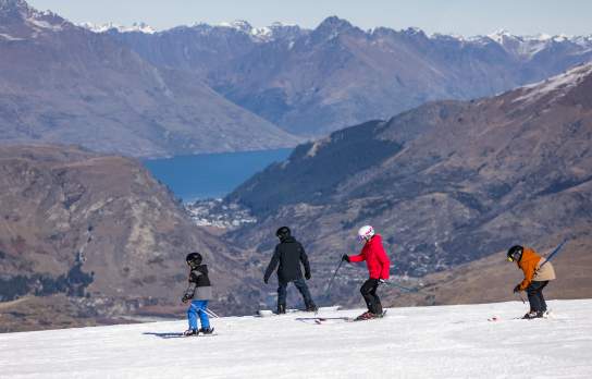 Coronet Peak Family ski lesson on a bluebird winters day