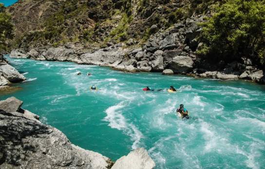 Group of people boarding down the river