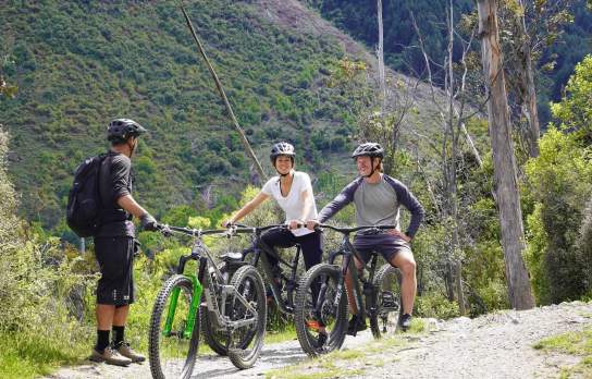 Group of people on a guided mountain biking tour. Credit The Ride Guide Queenstown