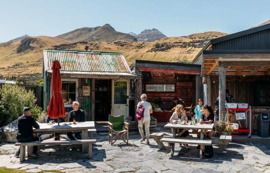 A group of people enjoying a beautiful day in Glenorchy at Mrs Wooly's General Store