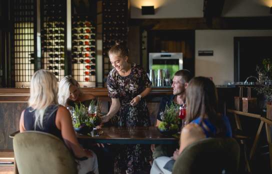 Waitress serving guests at Amisfield Restaurant