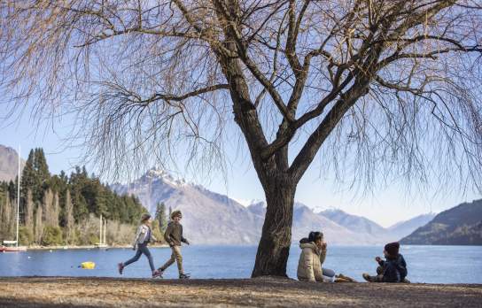 Family enjoying themselves on Queenstown Beach in spring