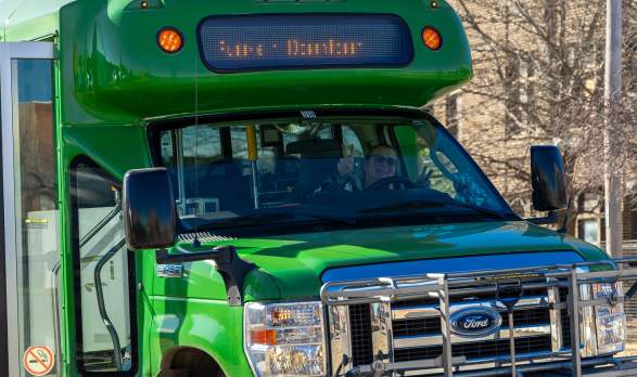 City Go bus in Salina Kansas with Bus driver posing making peace signs