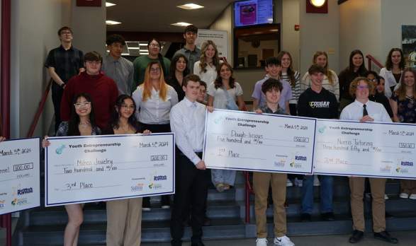 Group of people with checks with Project Open in Salina, Kansas