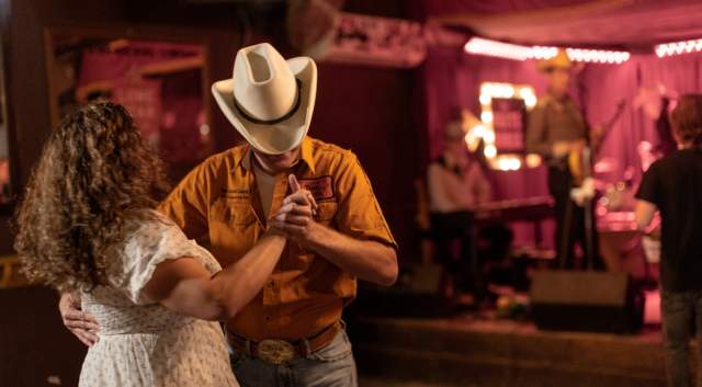 Man and woman two-stepping at White Horse