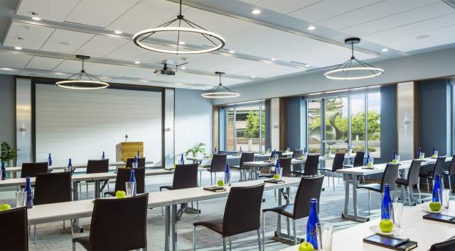 meeting room filled with chairs and projector at the Courtyard Marriott