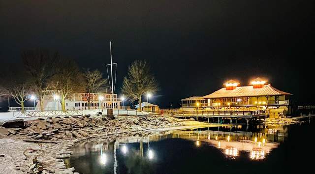Lake Champlain boathouse on a snowy winter evening