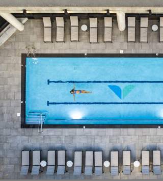 Woman relaxing in pool at Snowbird's Cliff Spa