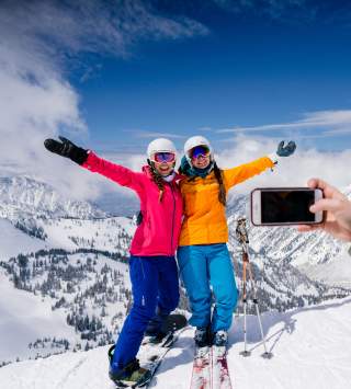 Friends at Snowbird taking a ski photo