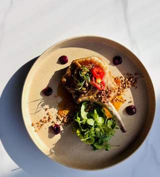 APRICOT & BOURBON GLAZED PORK CHOP from Felt Bar & Eatery