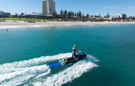 Jack Gibbs on Jet Ski in water near beach