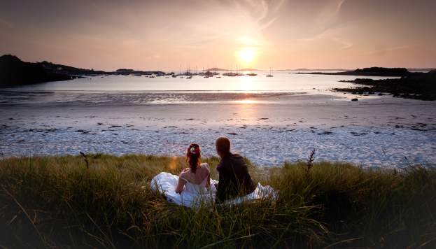 Wedding couple watching the sunset on St. Martin's