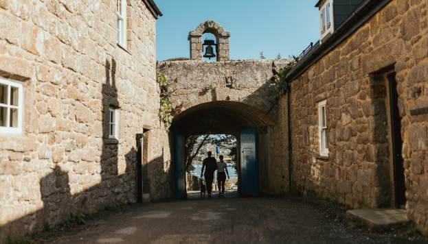 Couple walking through the Garrison Arch
