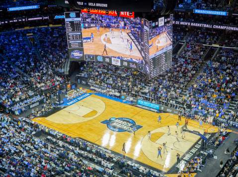 Aerial view of a basketball game being played at Xfinity Mobile Arena in Philadelphia with people in the stands