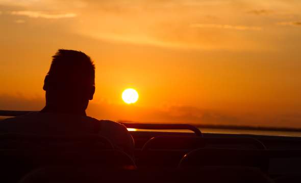 Silhouette- back of man's head with sunset in background on Kingfisher Fleet sunset cruise on Charlotte Harbor