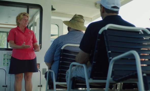 photo of Brenda Hillberry talking to guests aboard Kingfisher Fleet cruise