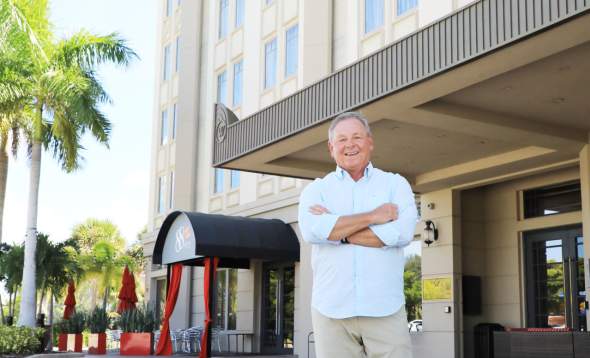 Business Development Director and Outsider in front of They Wyvern Hotel in Punta Gorda/Englewood Beach