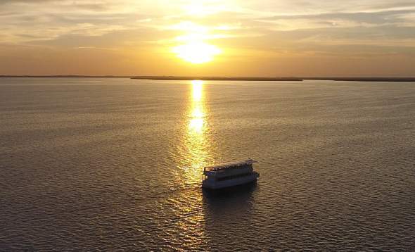 Aerial view of The Charlotte Lady (King Fisher Fleet Boat) on Charlotte Harbor for sunset cruise