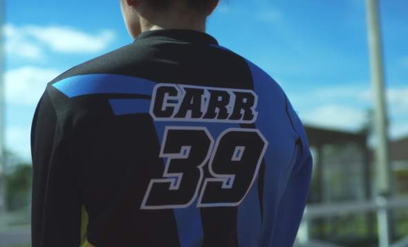 Image of back of Amanda Carr's BMX racing Jersey