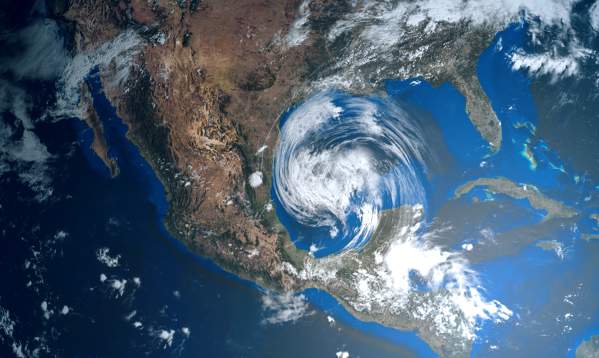 Satellite image of a hurricane that looks like a white vortex approaching the Gulf Coast of the United States and Mexico