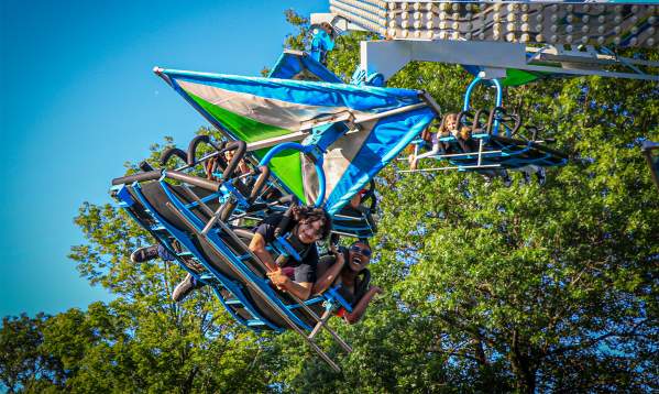 Group of friends on a carnival ride at Banks of the Wabash Festival in Terre Haute, Indiana