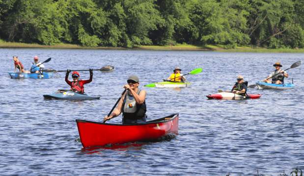Group of people kayaking on the river
