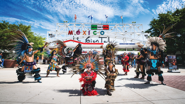 traditional Mexican dance in front of Mexican Fiesta festival grounds main gate