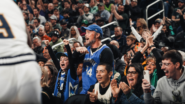 Fans of the Milwaukee Bucks cheer on their home town team at Fiserv Forum.
