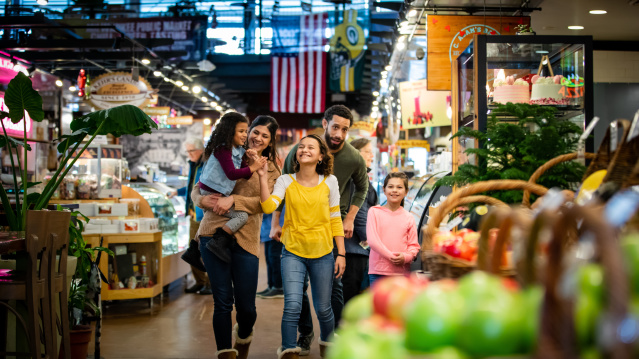 a family walking through the Milwaukee Public Market