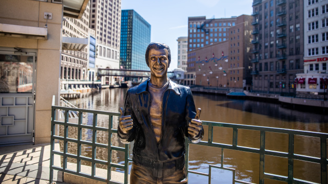 a bronze statue of the Happy Days character The Fonz on the Milwaukee RiverWalk