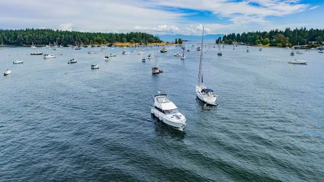 Two boats leaving the dock.