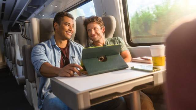 Guys riding on Brightline train