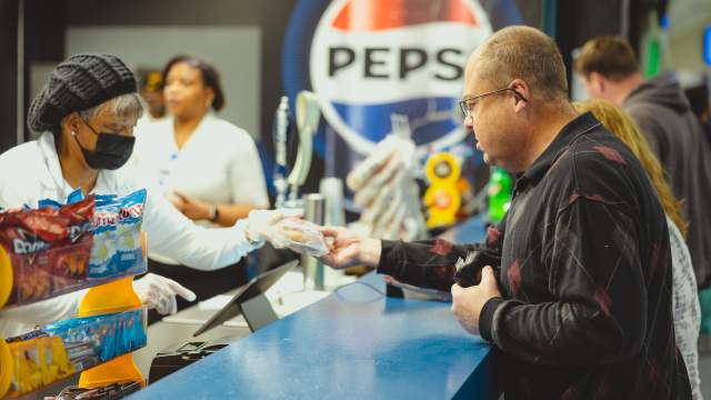 People purchasing snacks from concession stand