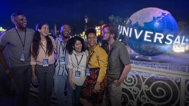 Group for meeting at Universal Orlando Resort by globe at night