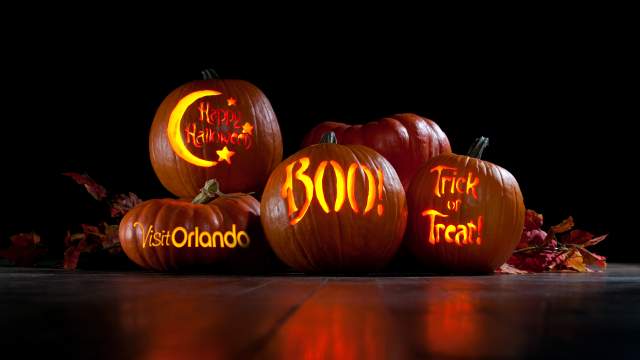 Pumpkins with Visit Orlando logo, Happy Halloween, Boo and Trick or Treat carved on them
