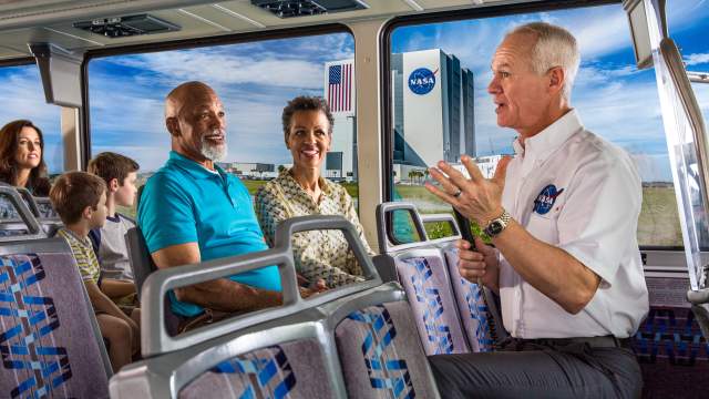Kennedy Space Center guide on tour bus