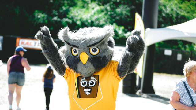 The Nanaimo Nightowls mascot posing for a photo.