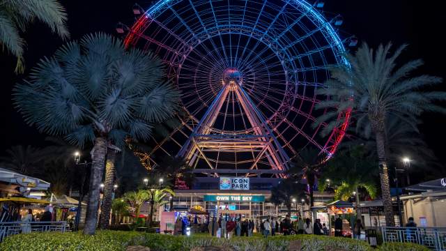 The Wheel lit up in red and blue at night