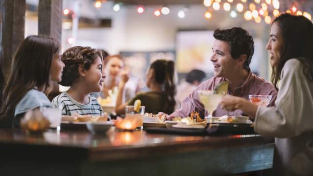 A family of four dining at Uncle Julio's at ICON Park