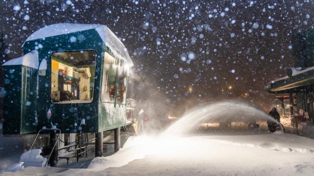 Guy snow blowing with snow falling at an Alta lift