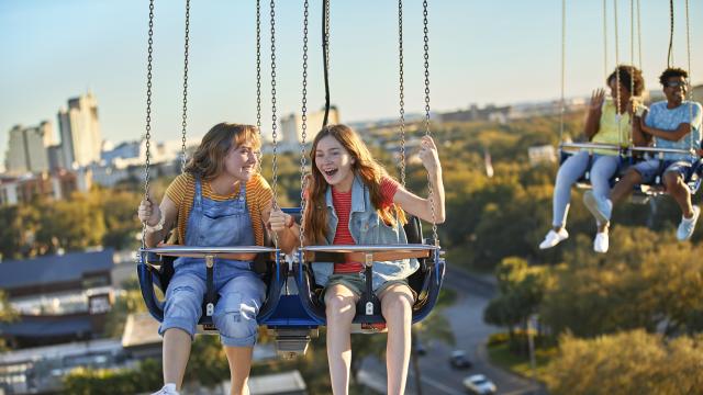 Two friends riding the Orlando Starflyer at ICON Park