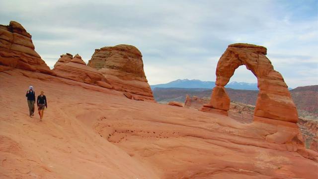 Hikers at Delicate Arch