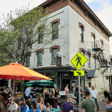 Crowded corner in downtown Winooski in the summer