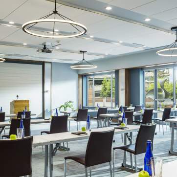 meeting room filled with chairs and projector at the Courtyard Marriott