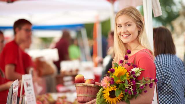 Person at farmers market with flowers