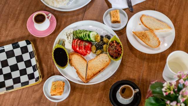 Turkish breakfast plates at Social Sloth Cafe in Lansing, Michigan, featuring Mediterranean dishes.